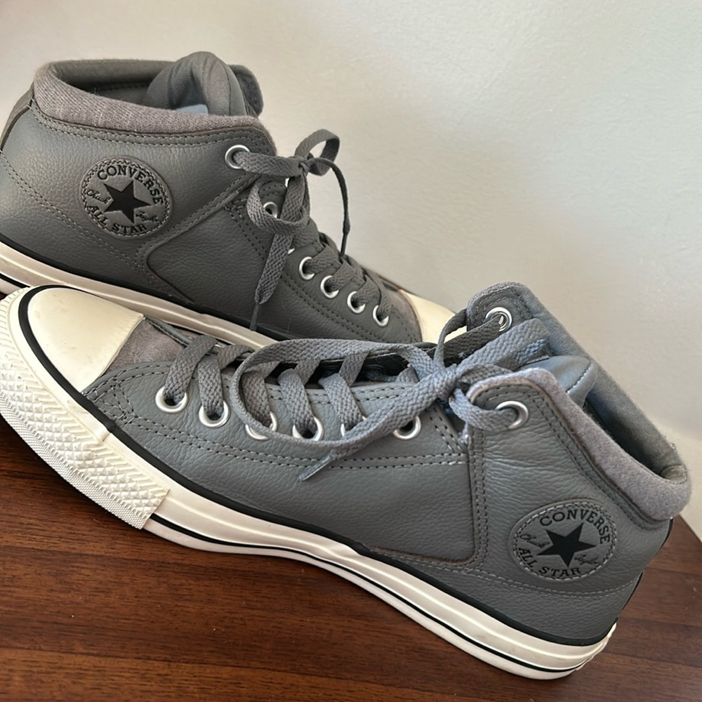 Gray leather converse